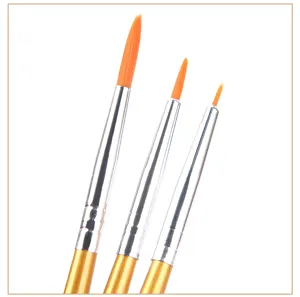 Detailed close-up of fine line paint brushes with orange bristles for professional art use.