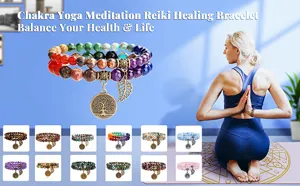 Natural stone chakra bead bracelet with tree of life pendant bohemian style jewelry detail view.