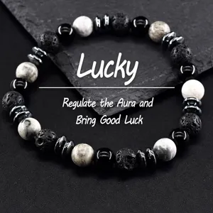 Close-up detail of mixed stone beaded bracelet featuring lava stone and hematite spacers.