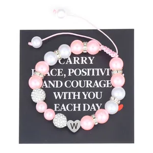 Handmade pink pearl bracelet with stainless steel initial W heart charm adjustable cord