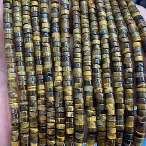 Close-up detail of natural tiger eye tube beads spacer loose beads for DIY craft making.