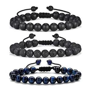 Set of 3 beaded bracelets featuring matte black, lava rock, and blue tiger eye stones.