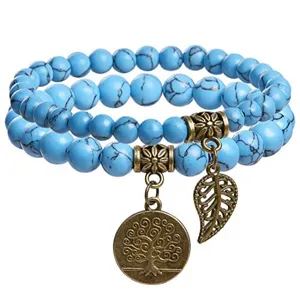 Bohemian turquoise beaded double layer bracelet with vintage tree of life and leaf charms.