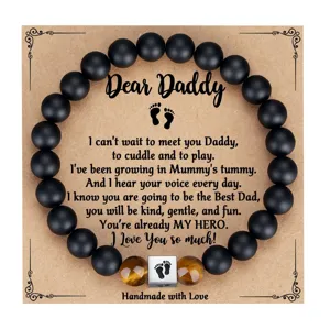 Mens beaded bracelet featuring matte black onyx and tiger eye stones with dad theme card.