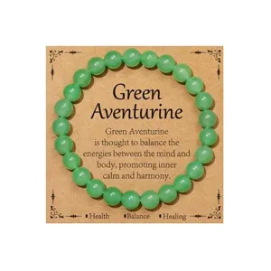 Green Aventurine beaded bracelet with display card for energy healing and inner calm.