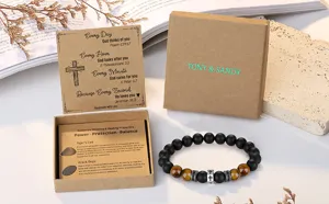 Detailed view of beaded bracelet featuring tiger eye and black onyx stones with cross charm.