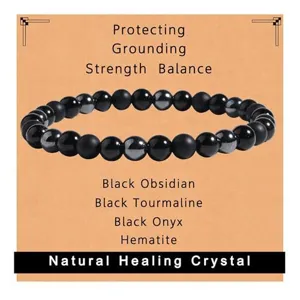 Natural black obsidian tourmaline onyx and hematite crystal beaded bracelet detail view.