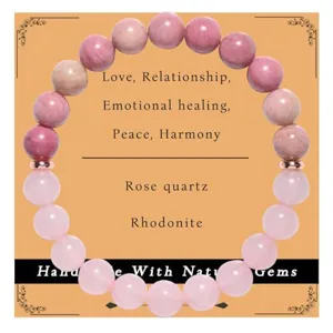 Natural rose quartz and rhodonite beaded crystal bracelet detail showing gemstone texture.