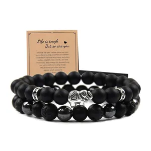 Conjunto de pulsera de cuentas doble con dijes de elefante y cuentas de piedra.