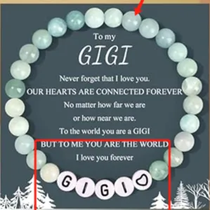 Close-up detail of the handmade beaded stone bracelet featuring custom letter beads and card.