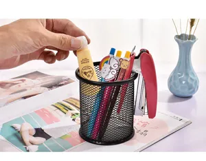 Detailed view of black metal mesh desk pen holder organizer, practical stationery storage cup.