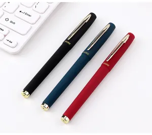 Detail shot of matte barrel gel pens in black, blue, and red with smooth writing tips.