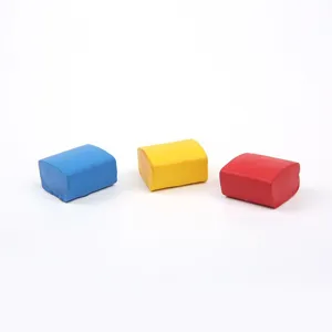 Close-up detail shot of three colorful solid watercolor paint blocks in blue, yellow, red.