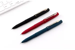 Matte finish ballpoint pens detail view, showcasing black, red, and blue writing pens.