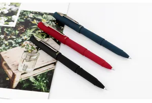 Detail view of Baoke 1828 frosted gel pens in black, red, and blue with smooth writing tips.