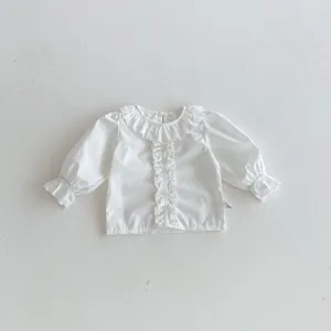 Infant baby white long sleeve blouse with delicate ruffles and cute bubble sleeves detail.
