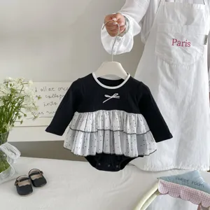 Baby girl long sleeve romper with cute mesh polka dot skirt layer, black and white design.