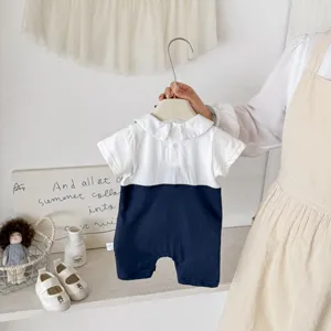 Detailed view of the baby contrast color romper, showing soft cotton fabric and collar.