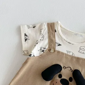 Infant baby summer short sleeve fake two-piece romper detail view showing cute dog graphic.
