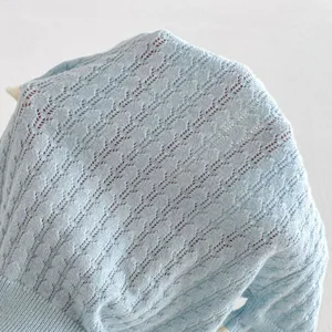 Light blue knitted short-sleeve top for girls, hollow knit summer fashion apparel detail view.