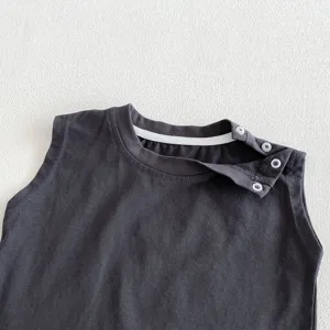 Detailed view of dark grey baby sleeveless romper with shoulder snaps and ribbed collar.