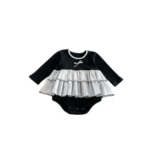 Baby girl long sleeve romper black ribbed bodysuit with white polka dot mesh skirt and bow.