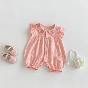 Cute baby summer romper with sweet cherry embroidery and delicate ruffles. Soft pink infant jumpsuit.