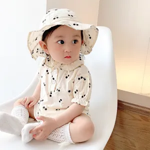 Cute baby girl short-sleeve romper with matching cherry print sun hat and socks for summer.