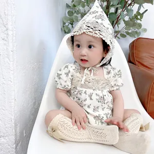 Adorable baby girl floral romper set with matching bonnet and lace socks for summer wear.