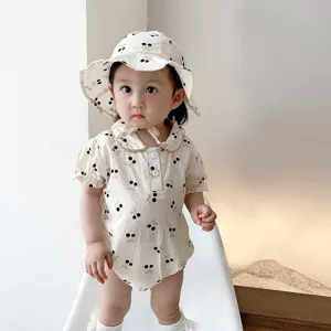 Baby summer cherry print short-sleeve romper with matching hat, cute baby apparel detail shot.