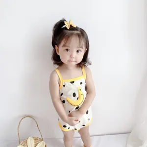 Detail view of summer baby strap romper, pure cotton fabric with cute cartoon patch design.