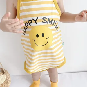 Infant cotton sling romper detail, yellow white stripes with cute happy smile graphic, summer wear.