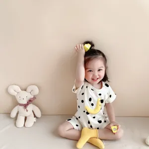Infant summer short sleeve romper with cute polka dots and moon graphic, soft baby cotton.