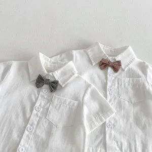 Toddler boys white short sleeve shirt detail, cute plaid bow tie and chest pocket design.