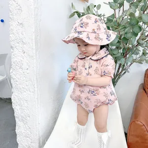Infant baby girl summer floral short sleeve romper bodysuit and hat set detail view.