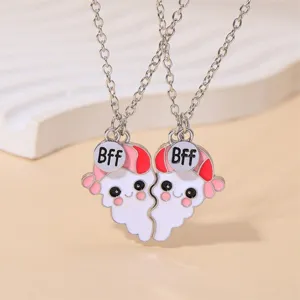 Cute BFF matching heart ghost pendant necklace for best friends in pink and white alloy.