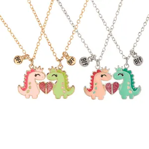 Cute dinosaur BFF couple necklace set with heart pendant in gold and silver finish options.