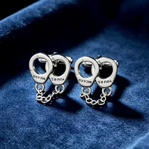 Boutons de manchette menottes argentées pour chemise homme, bijou fantaisie en métal.