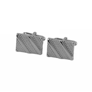 Detailed shot of men's gunmetal square textured cufflinks, perfect formalwear accessory.