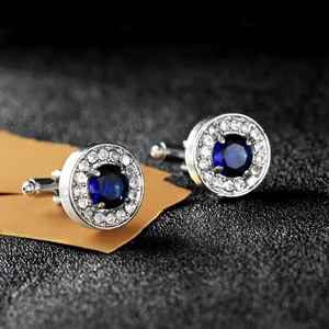 Round blue crystal rhinestone cuff links detail shot, elegant silver tone accessory