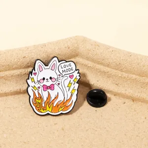 Close-up detail shot of the cute cat enamel pin featuring vibrant colors and black rubber clutch.