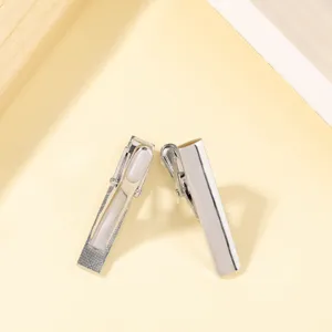 Stainless steel tie clip detail shot, elegant silver men accessory for business suit shirt.