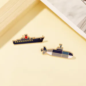 Detailed view of military warship and submarine enamel pins, stylish alloy clothing badges.