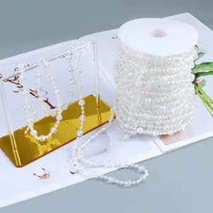 Wedding crystal bead garland roll, transparent decorative pearl string for party and event decor.