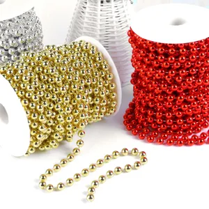 Detailed closeup of colorful beaded chains for DIY crafts, wedding and festive party decor.