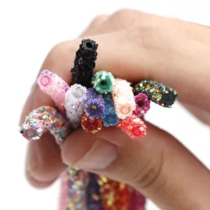 Colorful rhinestone tubes detail close-up for DIY shoe charms and hair clips handmade.