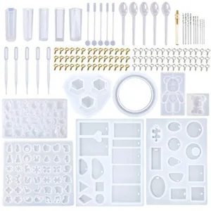 Epoxy resin casting mold kit with silicone molds, droppers, screw eyes, and DIY crafting tools.