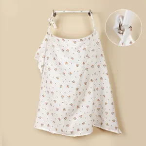 Floral cotton muslin nursing cover detail featuring adjustable strap and metal ring buckle.
