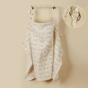 Floral cotton nursing cover with adjustable metal rings and breathable double gauze fabric.