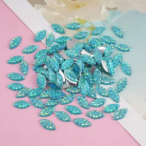 Close-up details of sparkling blue resin marquise rhinestones designed for DIY craft accessories.